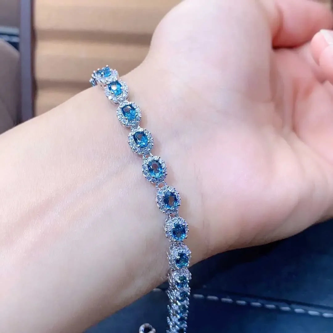 Natural Blue Topaz ,This exquisite natural blue topaz bracelet features crystals and sterling silver inlaid with meticulous precision, - CRYSTALOIL