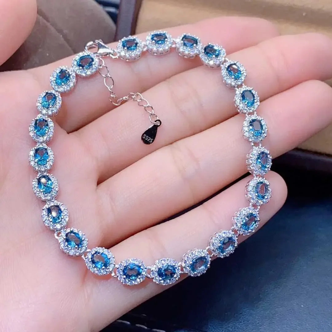 Natural Blue Topaz ,This exquisite natural blue topaz bracelet features crystals and sterling silver inlaid with meticulous precision, - CRYSTALOIL