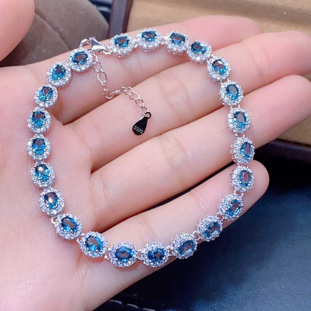 Natural Blue Topaz ,This exquisite natural blue topaz bracelet features crystals  and sterling silver inlaid with meticulous precision, - CRYSTALOIL