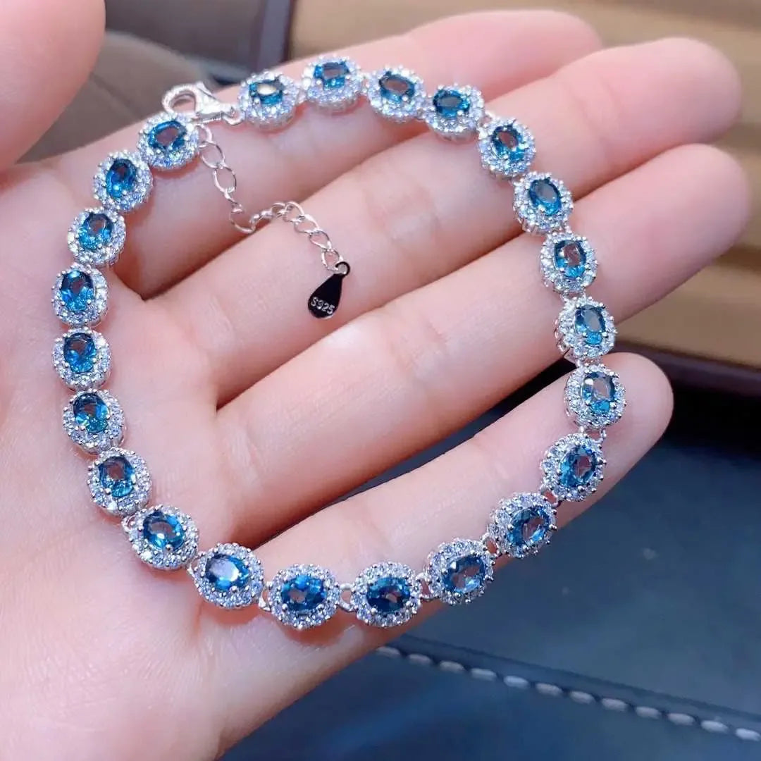 Natural Blue Topaz ,This exquisite natural blue topaz bracelet features crystals and sterling silver inlaid with meticulous precision, - CRYSTALOIL