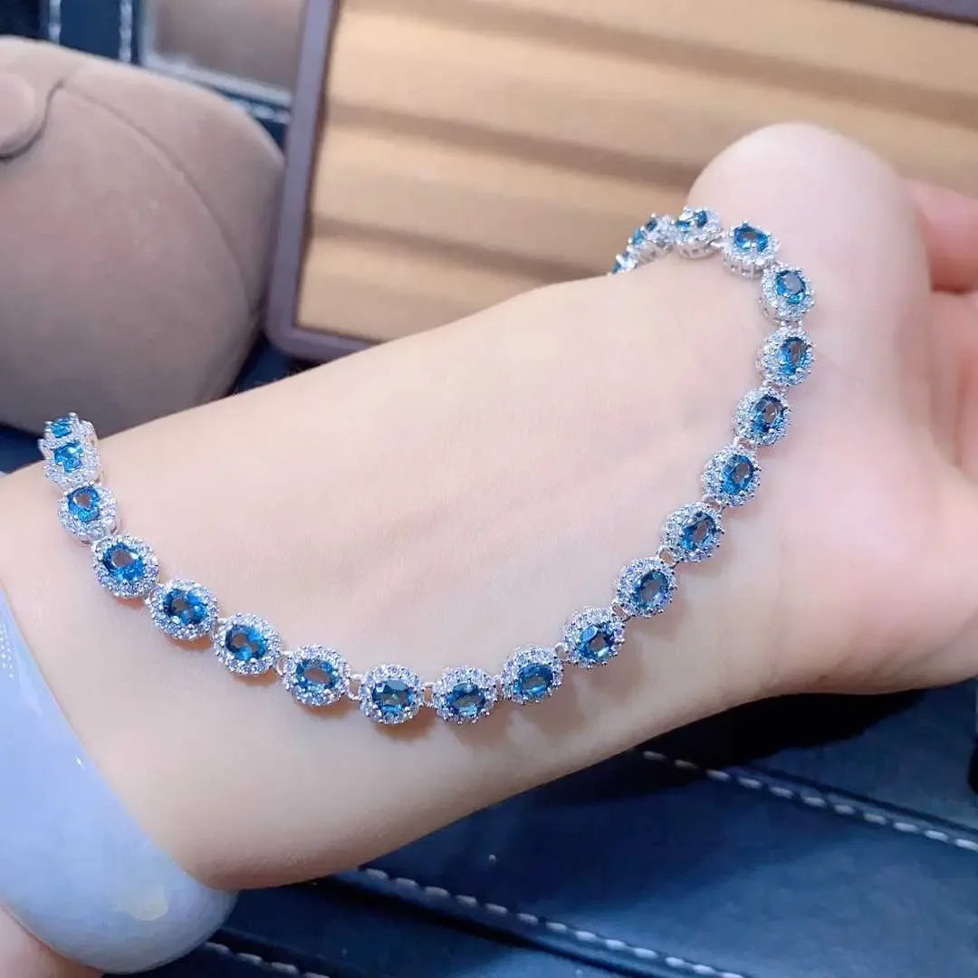 Natural Blue Topaz ,This exquisite natural blue topaz bracelet features crystals and sterling silver inlaid with meticulous precision, - CRYSTALOIL
